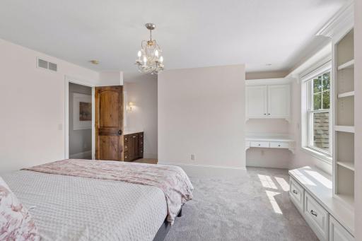 Another view of one of the bedrooms highlighting the built-ins and this room's Jack & Jill vanity.