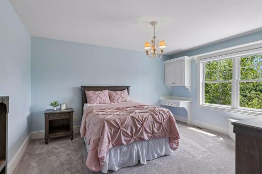 The other bedroom is the mirror image of the other bedroom with a built-in desk, bench with book shelving, a walk-in closet and access to the Jack & Jill bathroom.