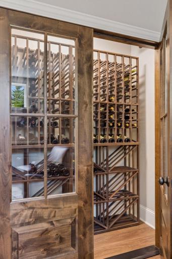 The home includes a unique temperature controlled wine celler with French doors and racks. It can hold up to 400 bottles of wine. Let the collecting begin!