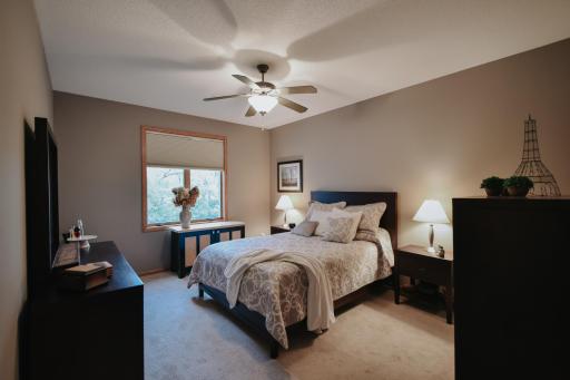 Primary bedroom; spacious oasis! king bed fits with plenty of room to walk around. Carpet has been updated. New ceiling fan.