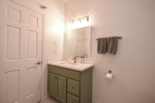 Spacious linen closet in the guest bath, noted 6 panel door.