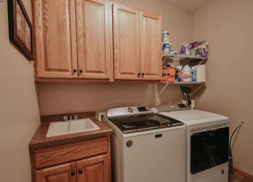 Laundry room with utility sink, new a/c new furnace, water heater.