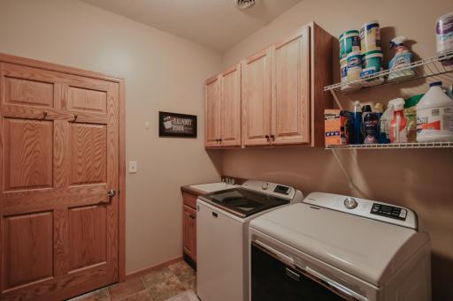 Great storage space/cabinets above the washer/dryer. Solid 6 panel door.