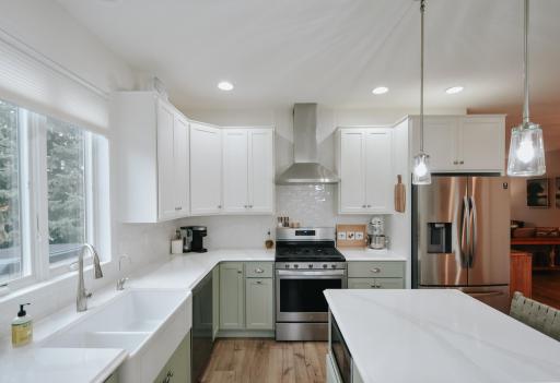 Gorgeous updated kitchen! all new from from to ceiling; cabinets, backsplash, quartz countertops, new appliances, touch faucet, garbage disposal.
