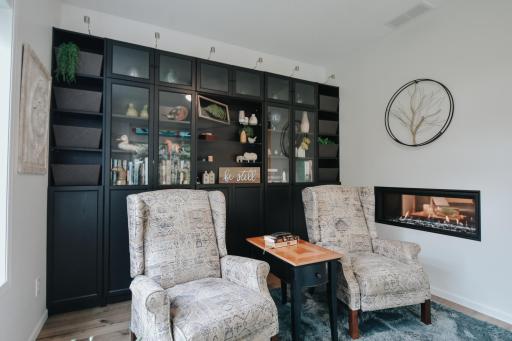 relax, unwind and enjoy the fireplace, natural light and all the storage this room has to offer.