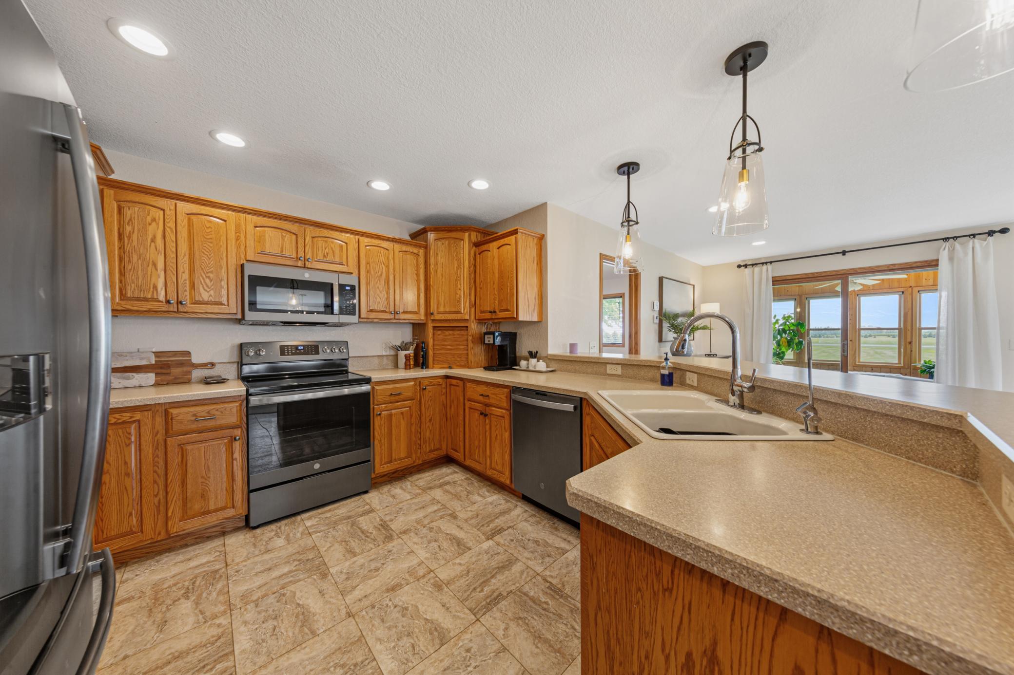Kitchen with brand new range & microwave