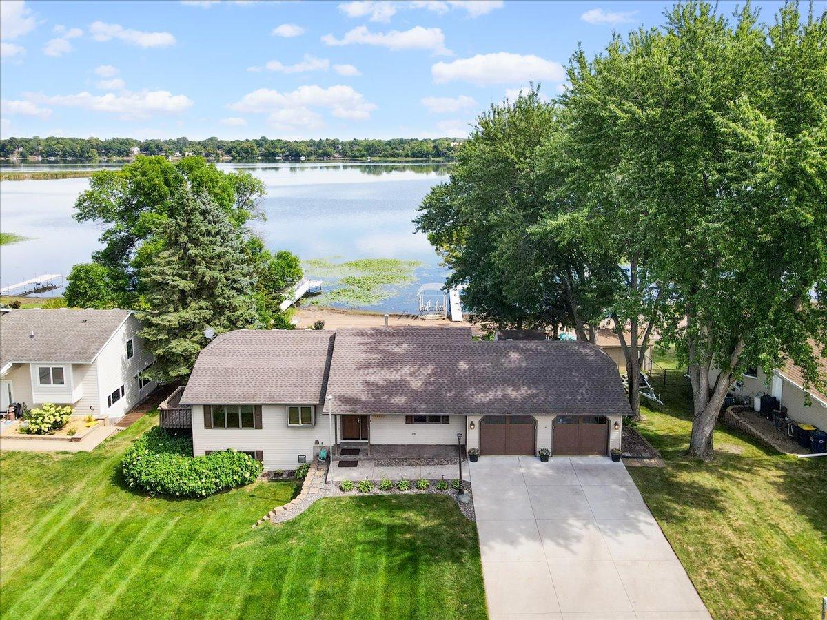 A Lake View Worth Coming Home To North Center Lake creates a beautiful backdrop for everyday life at 31117 Peninsula Avenue.