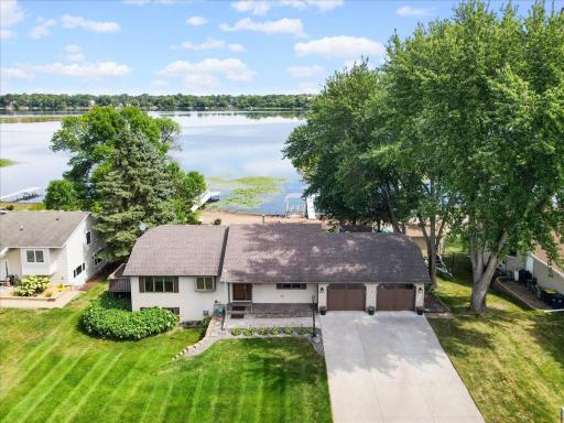 A Lake View Worth Coming Home To North Center Lake creates a beautiful backdrop for everyday life at 31117 Peninsula Avenue.