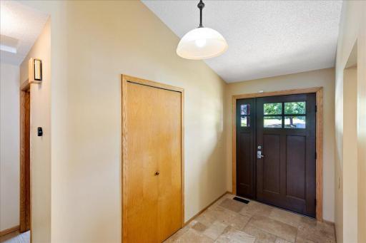 A Bright and Practical Entryway Natural light, tile flooring, and a convenient coat closet make arrivals organized and inviting.