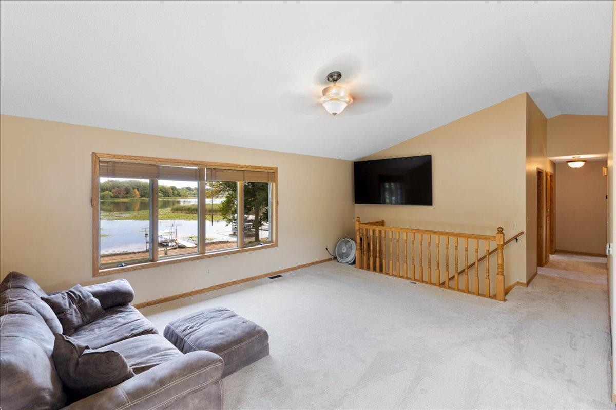 Your Everyday View of North Center Lake Imagine settling into the living room and watching the lake change with the seasons through this expansive window.