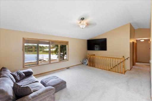 Your Everyday View of North Center Lake Imagine settling into the living room and watching the lake change with the seasons through this expansive window.