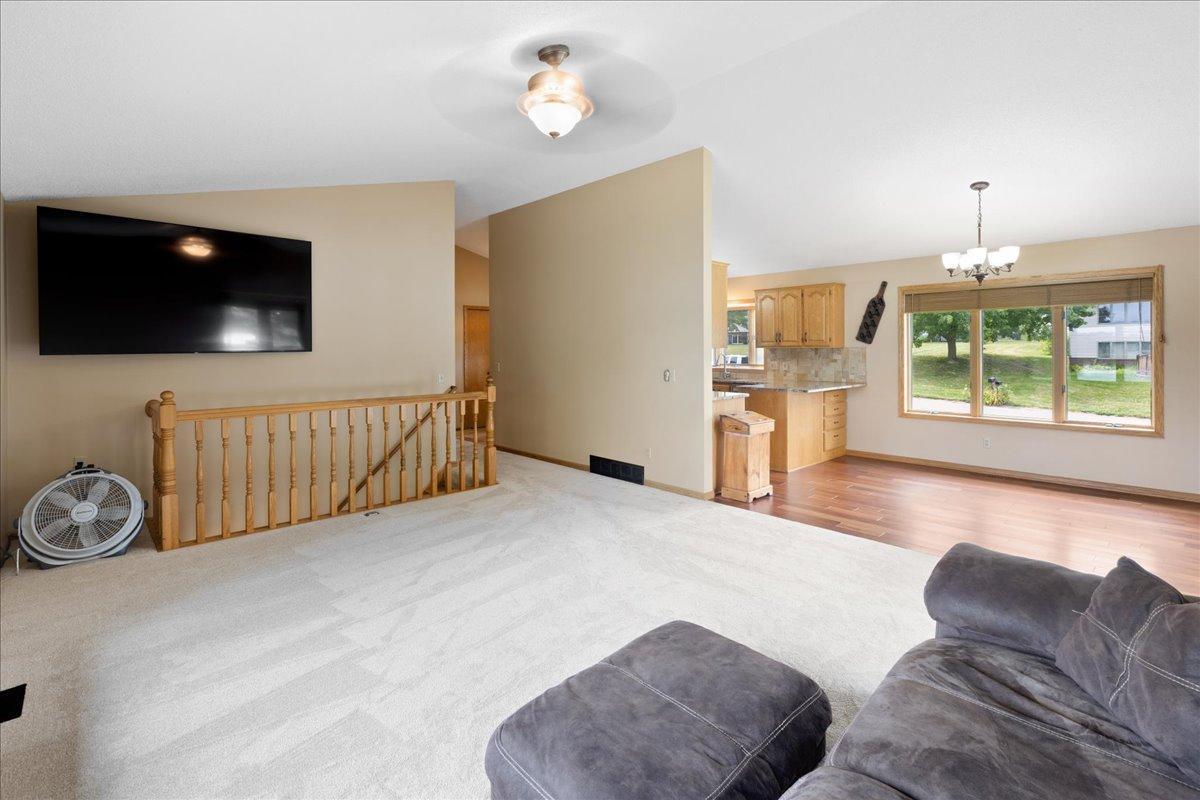 An Open Layout Made for Togetherness The connected living, dining, and kitchen spaces allow conversation to continue wherever family and friends gather.