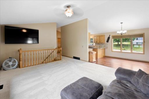 An Open Layout Made for Togetherness The connected living, dining, and kitchen spaces allow conversation to continue wherever family and friends gather.