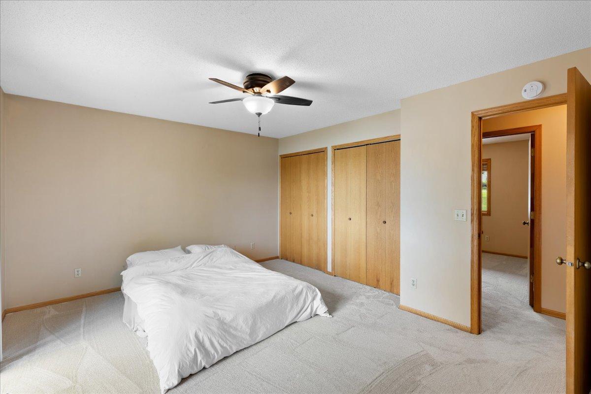 Primary bedroom with his and hers closets