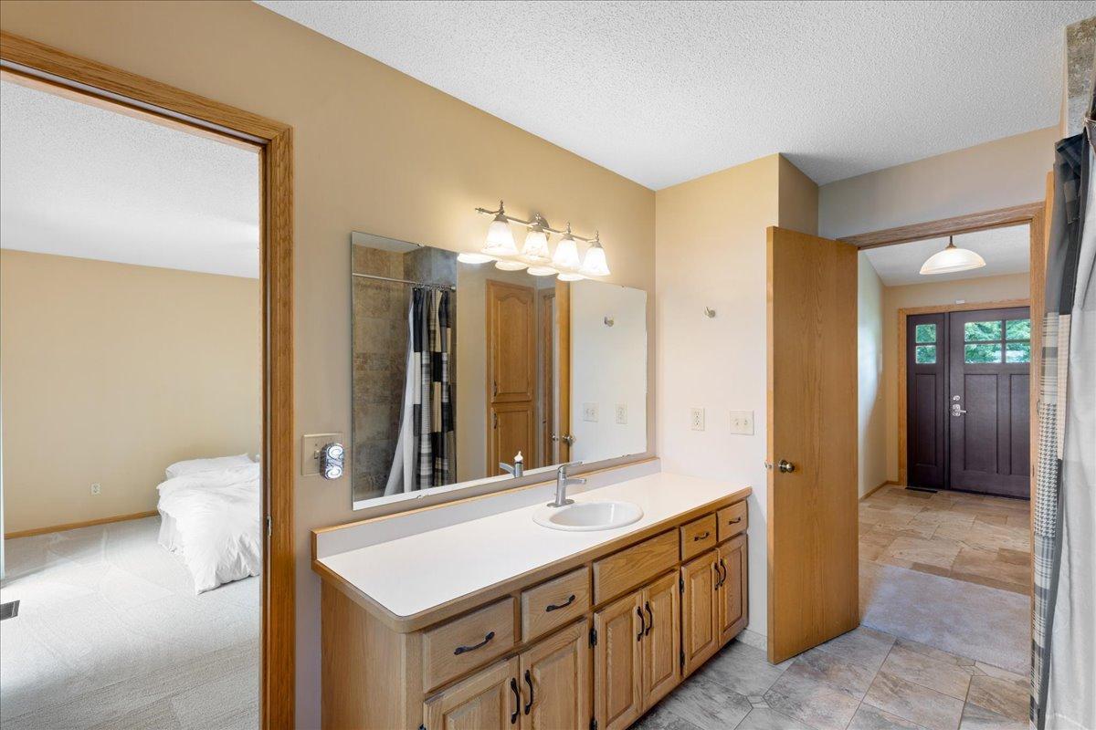 Walk through from bedroom to bathroom for convenience to the primary bedroom