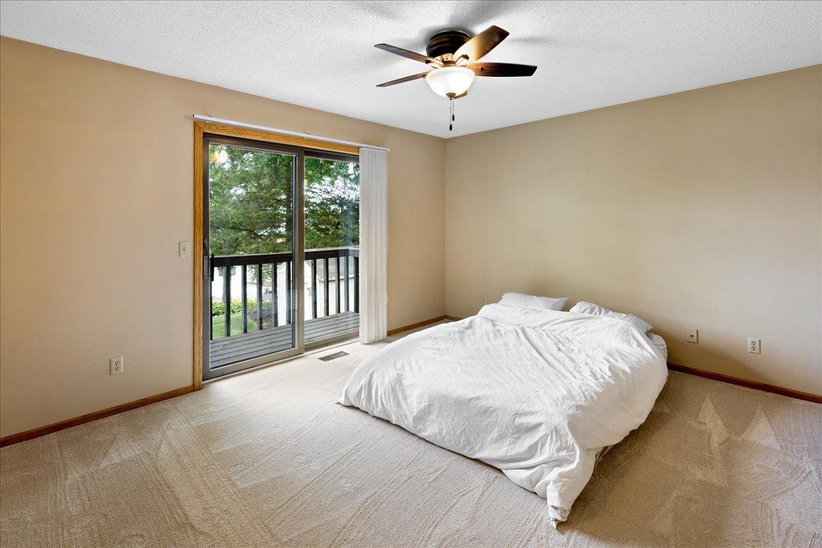 Primary bedroom with private balcony overlooking th lake