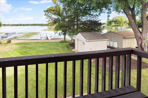 Imagine Waking Up to This View The private balcony off the bedroom suite overlooks the lawn and North Center Lakeâs peaceful shoreline.