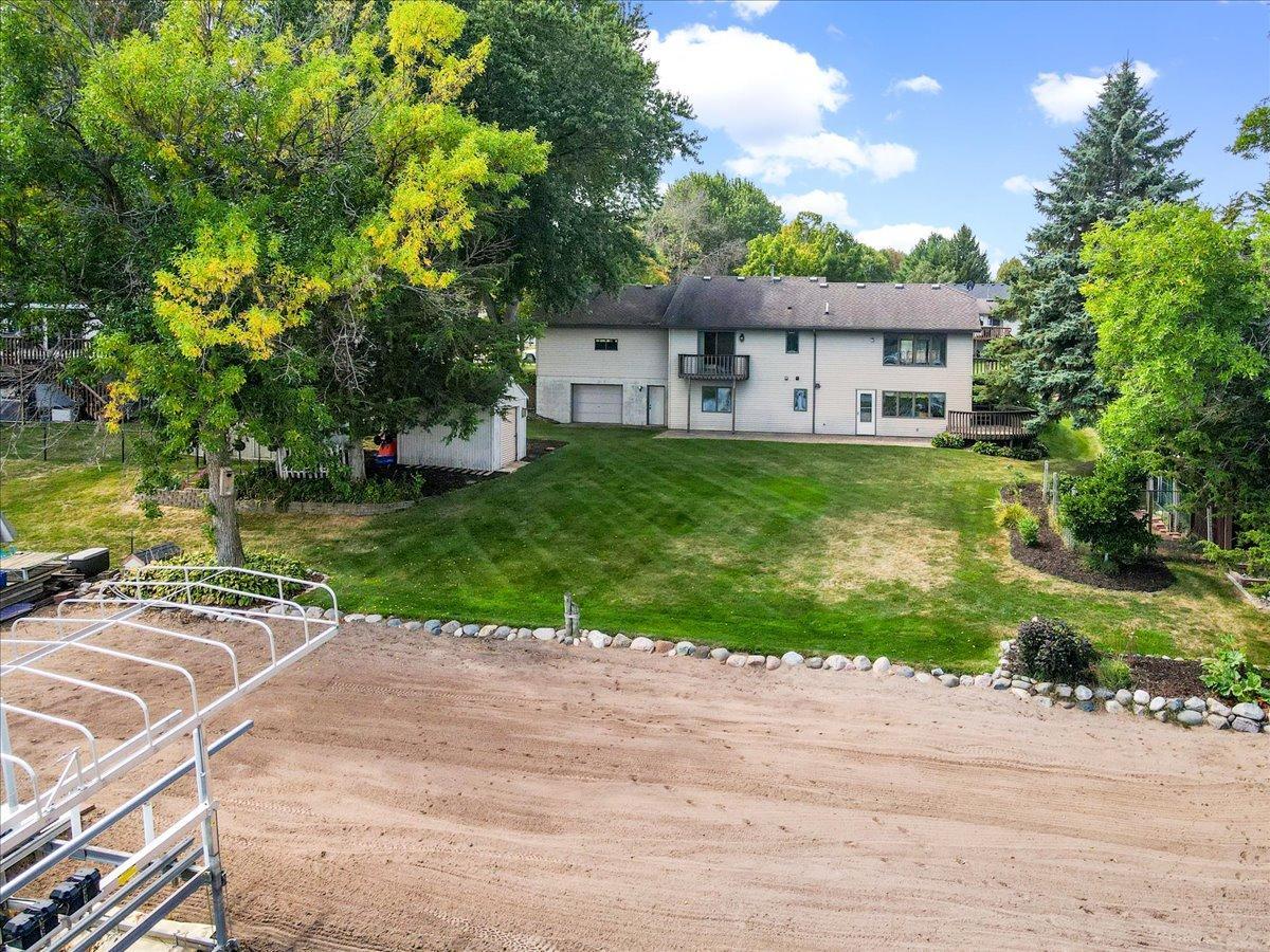 Designed Around the Lake Lifestyle A balcony, deck, patio, workshop, storage shed, and level lawn make the waterfront easy to enjoy.