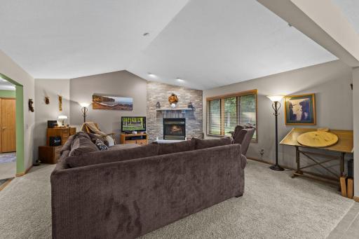 Open living room with gas fireplace~