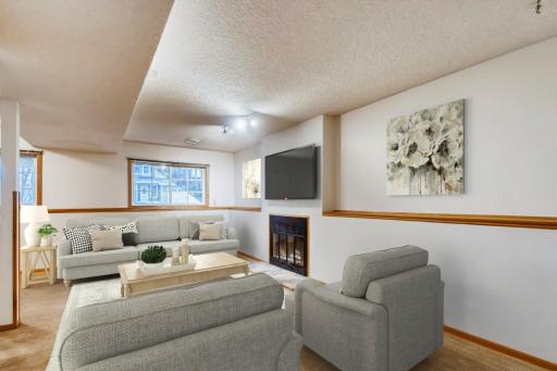 Lower level living room with wood burning fireplace!