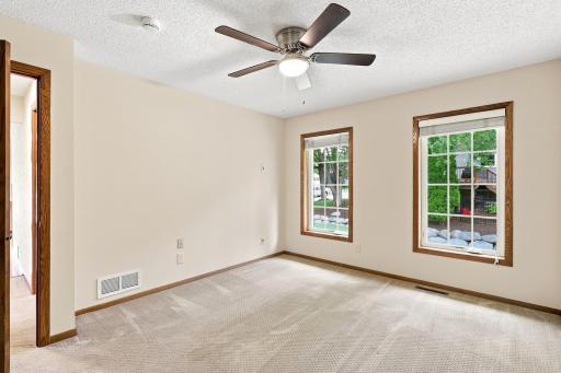 Primary bedroom with walk in closet and pass through to main level bathroom.
