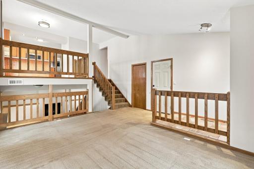 Soaring vaulted ceilings! Modern railing and fixtures!