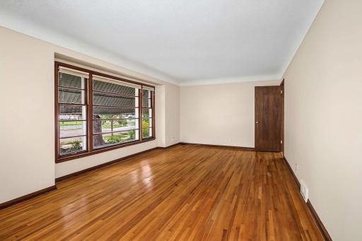 Original hardwood floors extend throughout much of the main level, and freshly painted neutral walls provide a welcoming backdrop for your personal style.