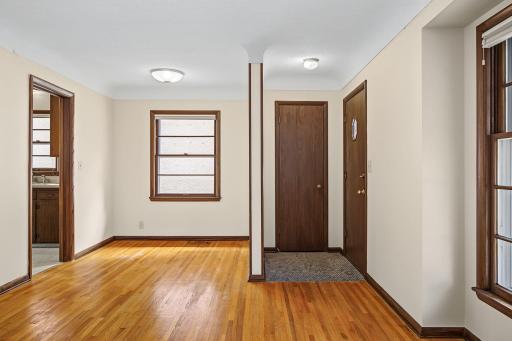 Welcoming foyer entrance with a tile floor and a convenient guest coat closet.