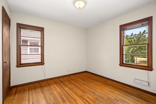 Bedroom 2, of three bedrooms on this homes main level that welcome room for growth.