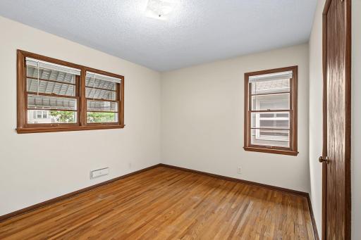 Bedroom 3, has a larger set of windows that overlook the front of the home.
