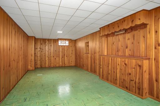 The generous family/amusement room offers space for comfortable seating and movie nights, along with room for a billiards or game table.