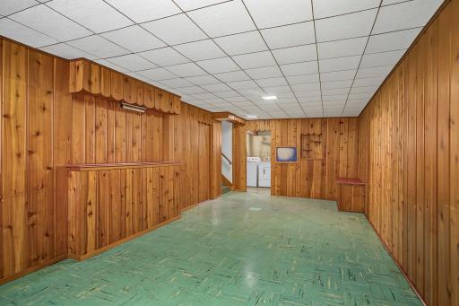 Classic knotty-pine walls create a cozy "up north" atmosphere while vinyl flooring throughout much of the lower level makes cleanup easy.