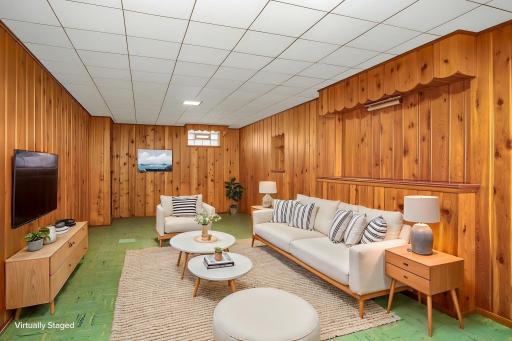 Virtually staged to show how versatile the family/amusement room space can be.