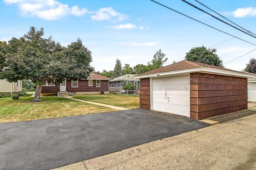Oversized one car garage with a convenient side service door and a large, freshly seal coated, driveway.