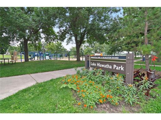 Lake Hiawatha Park, playground/tot lot with picnic tables and walking paths throughout.