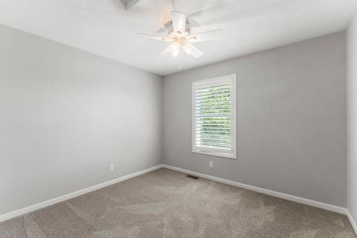 Each with cozy carpet, ceiling fans, and shutters.