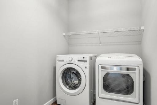 Dedicated upper-level laundry room keeps daily routines simple.