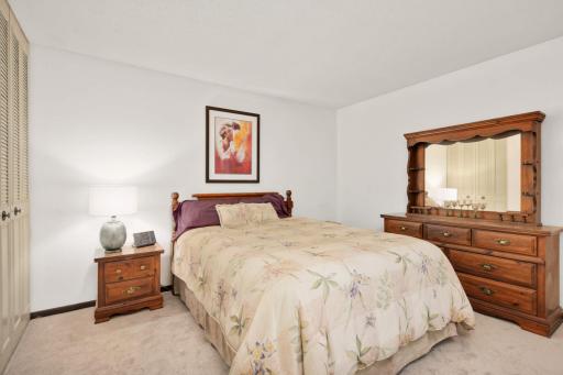Spacious primary bedroom with generous layout, neutral finishes, and ample room for a full bedroom set.
