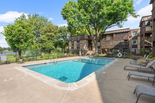 Spend summer days at the outdoor swimming pool surrounded by mature landscaping and comfortable lounging areas.