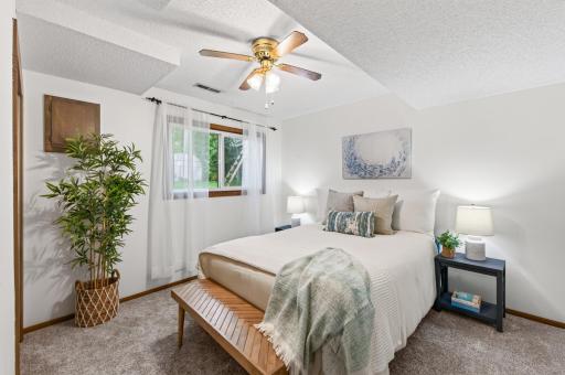 Your private escape awaits. This inviting primary bedroom offers the perfect place to unwind and recharge.