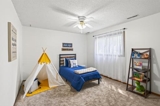 A comfortable second bedroom offering the perfect space for guests, a home office, or whatever fits your lifestyle.