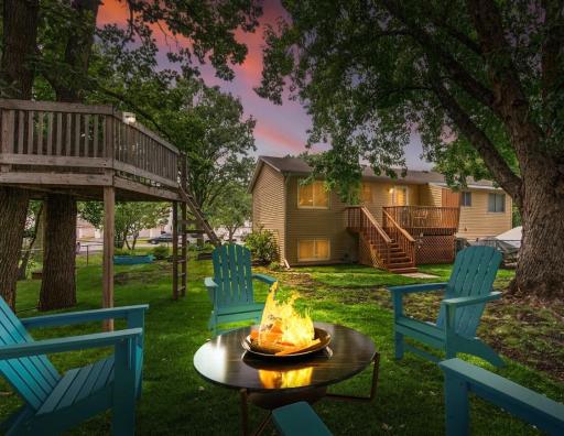 Imagine evenings gathered around the fire in this inviting backyard space. *Virtually staged to showcase the potential of this outdoor area, creating the perfect setting for relaxing, entertaining, and making memories.jpg