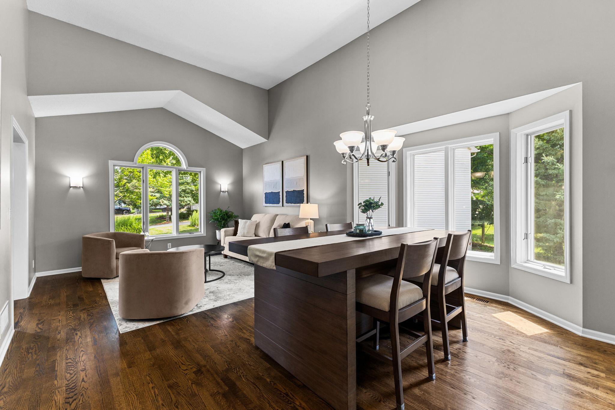Soaring vaulted ceilings and walls of windows fill the main living spaces with natural light.