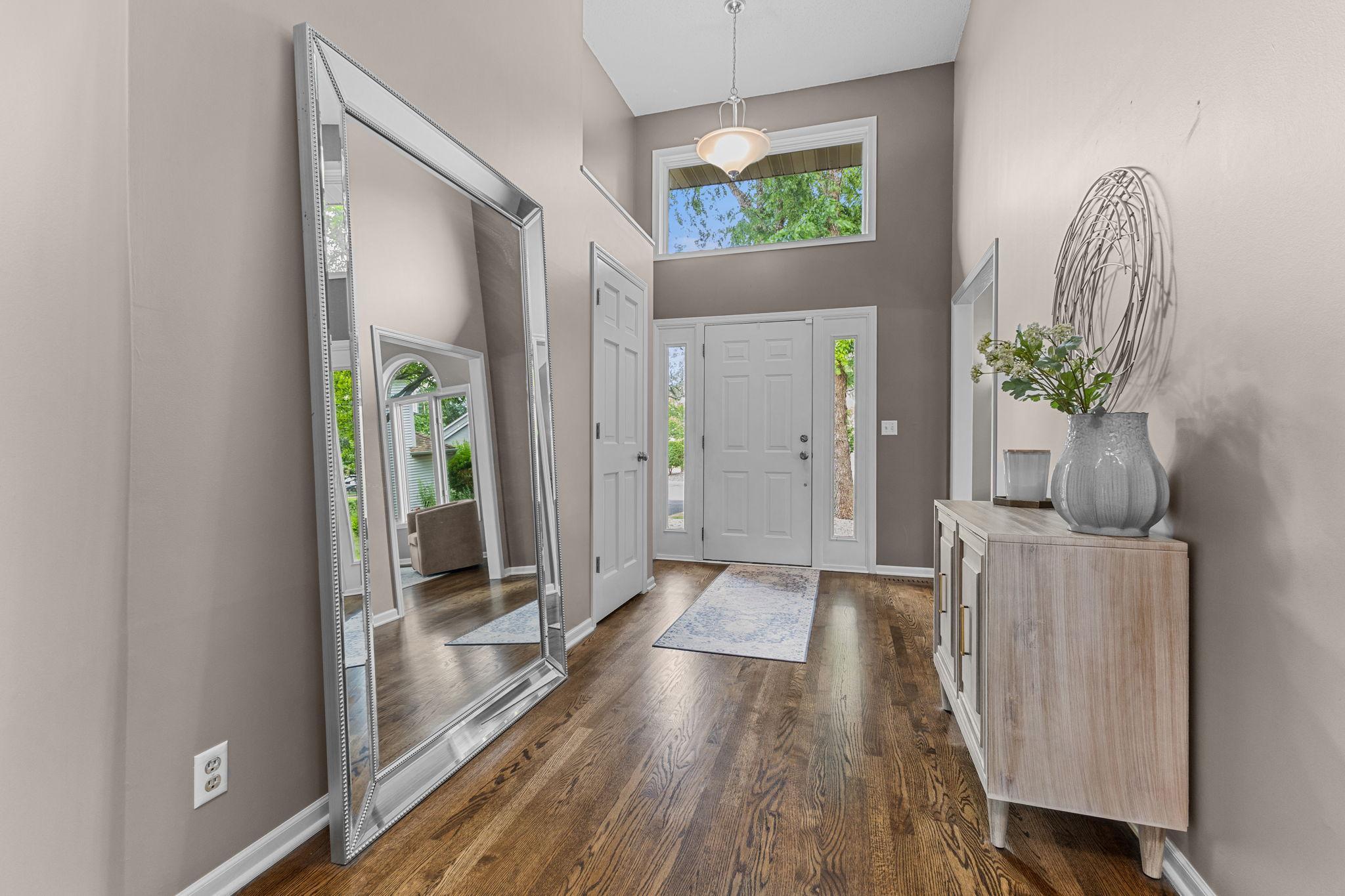 A grand two-story foyer welcomes guests with an airy, elegant first impression.