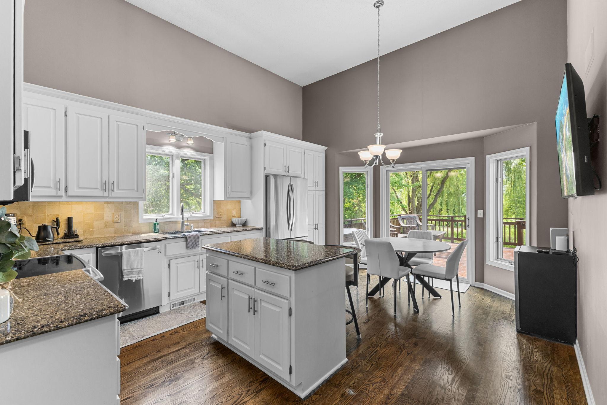 An oversized island offers the perfect gathering place while enjoying the updated kitchen.