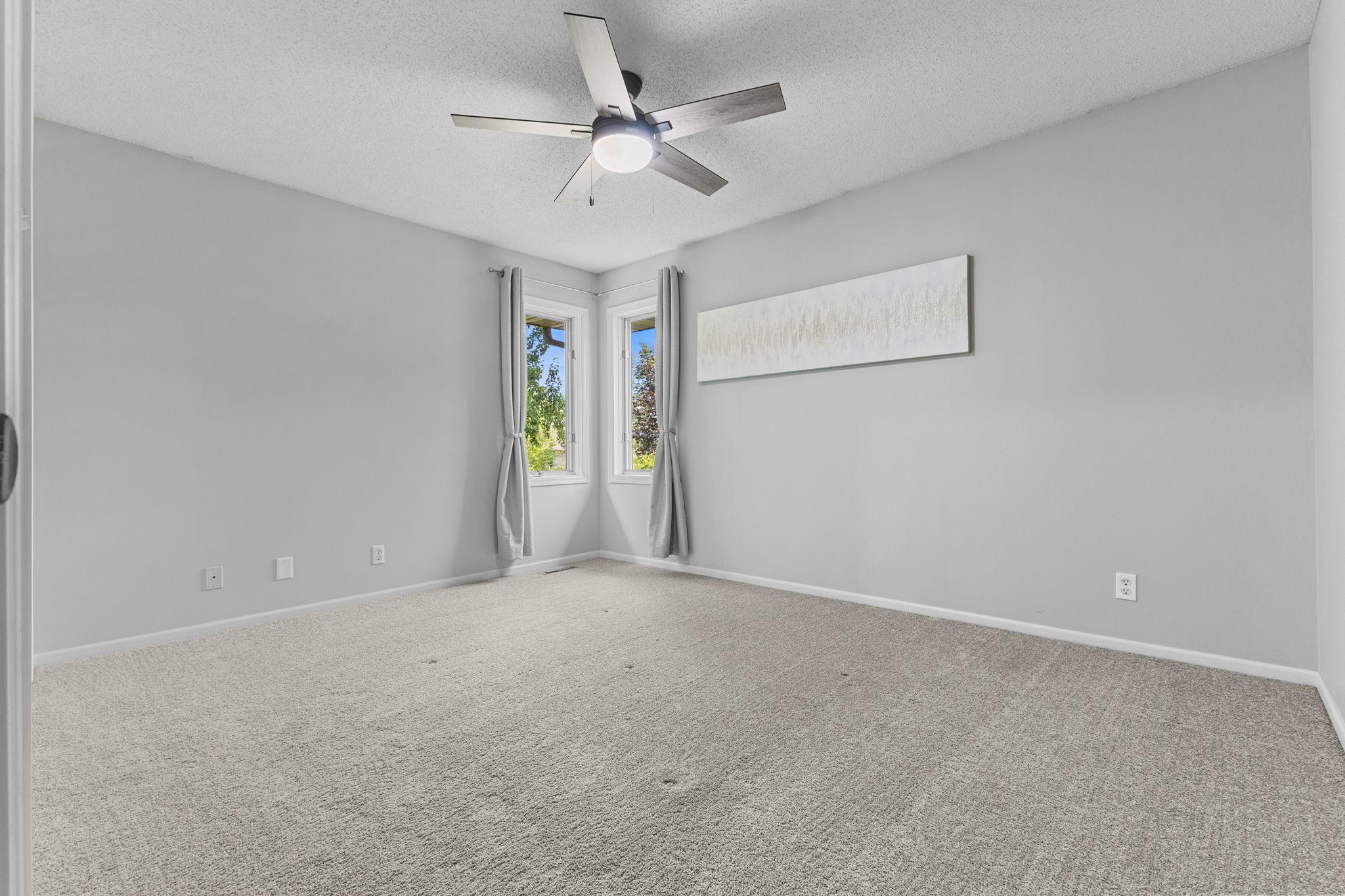 A spacious bedroom convenient to the other two bedrooms on this upper level.