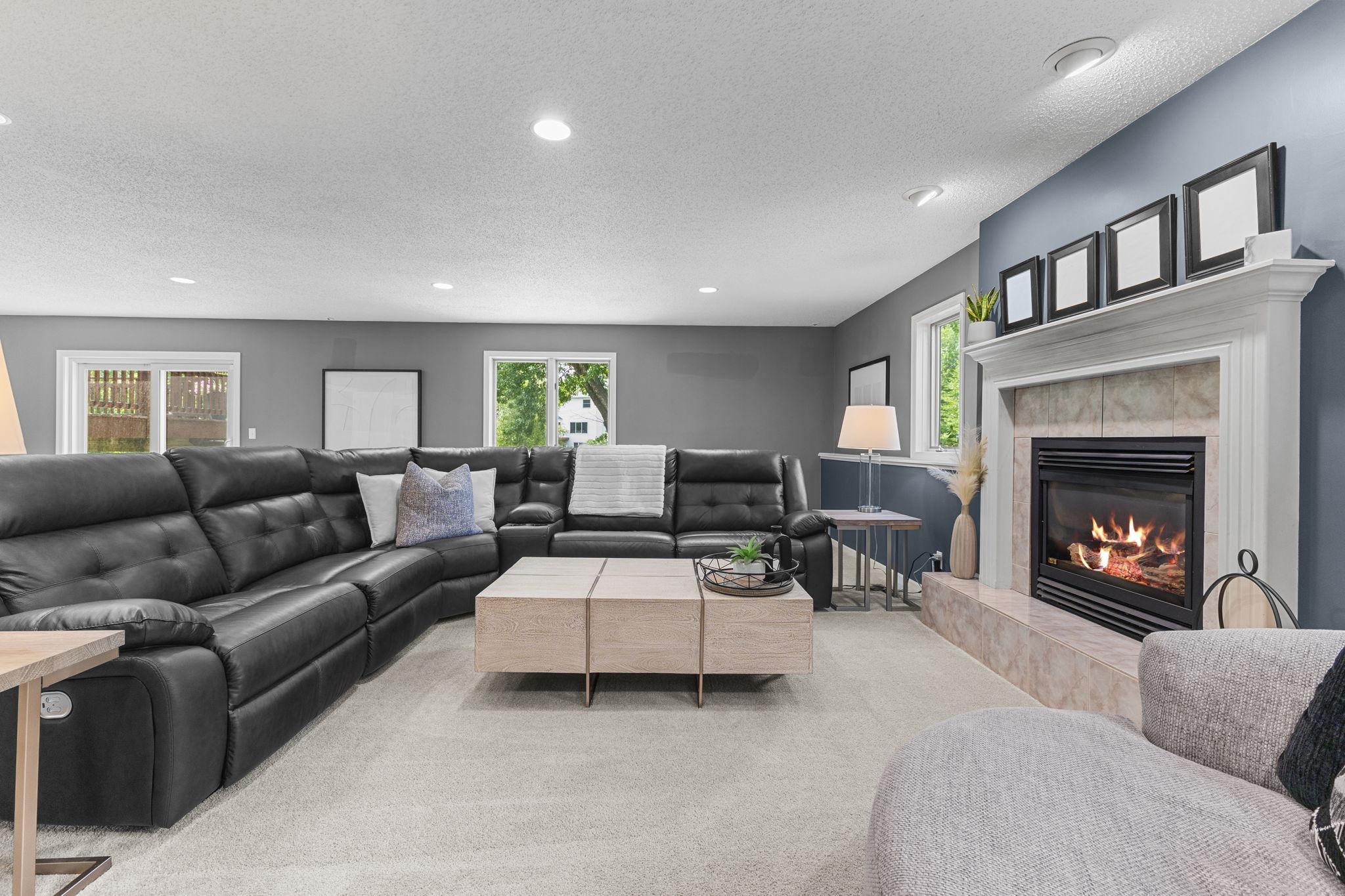 Multiple living spaces give everyone room to relax, work, or play.