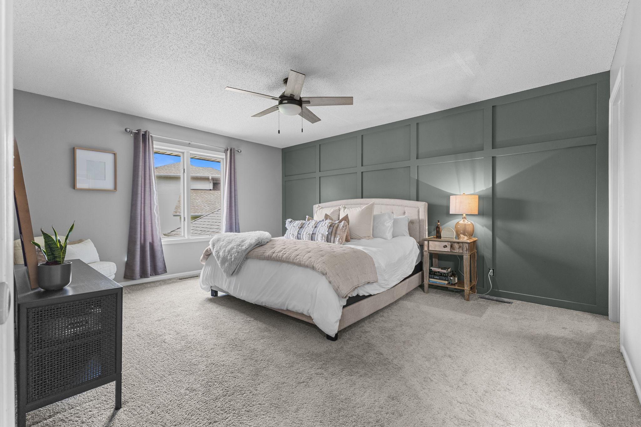 A spacious primary suite offers the perfect place to recharge at the end of the day.