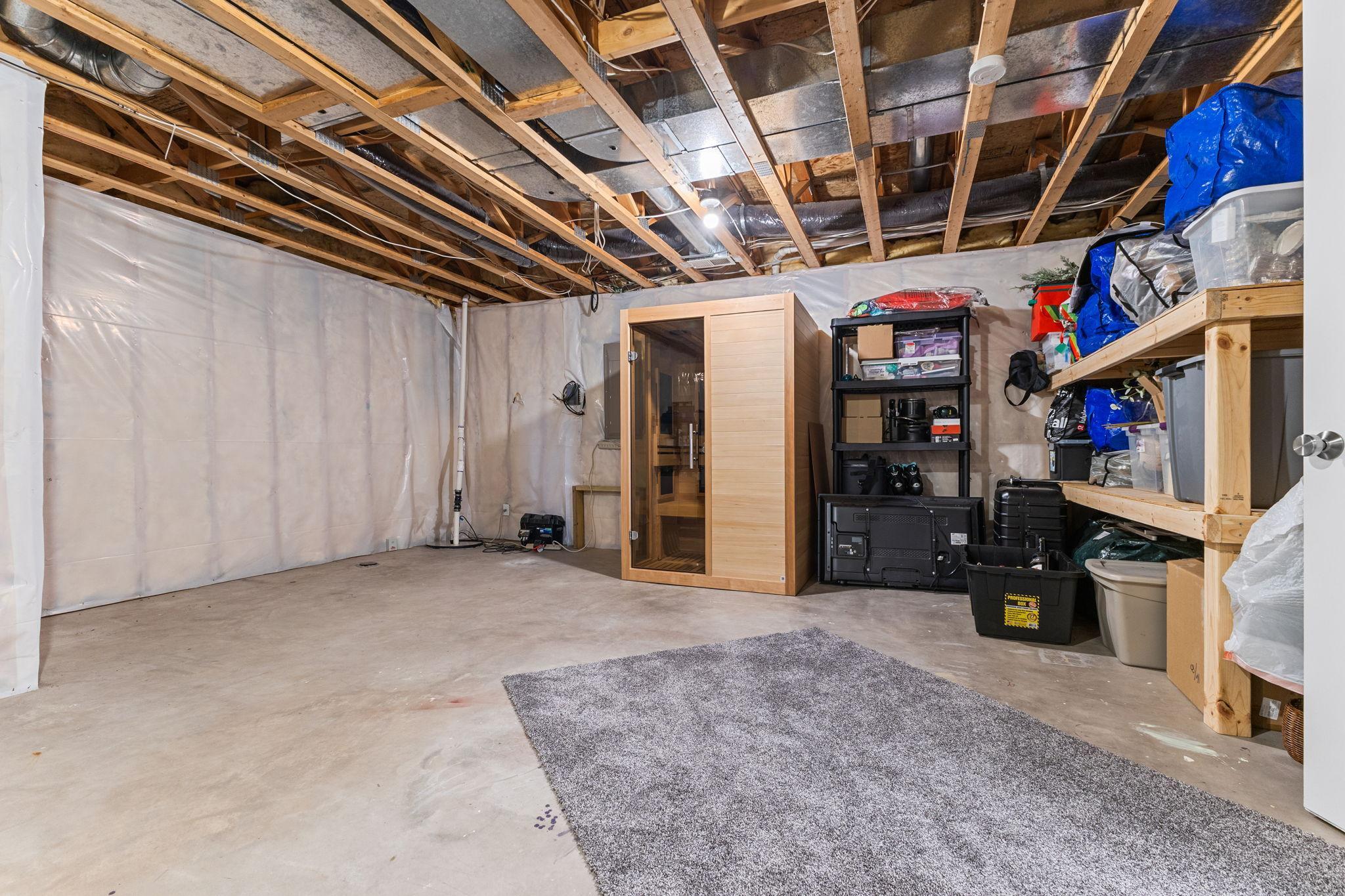 An unfinished storage area provides incredible organization and future possibilities.