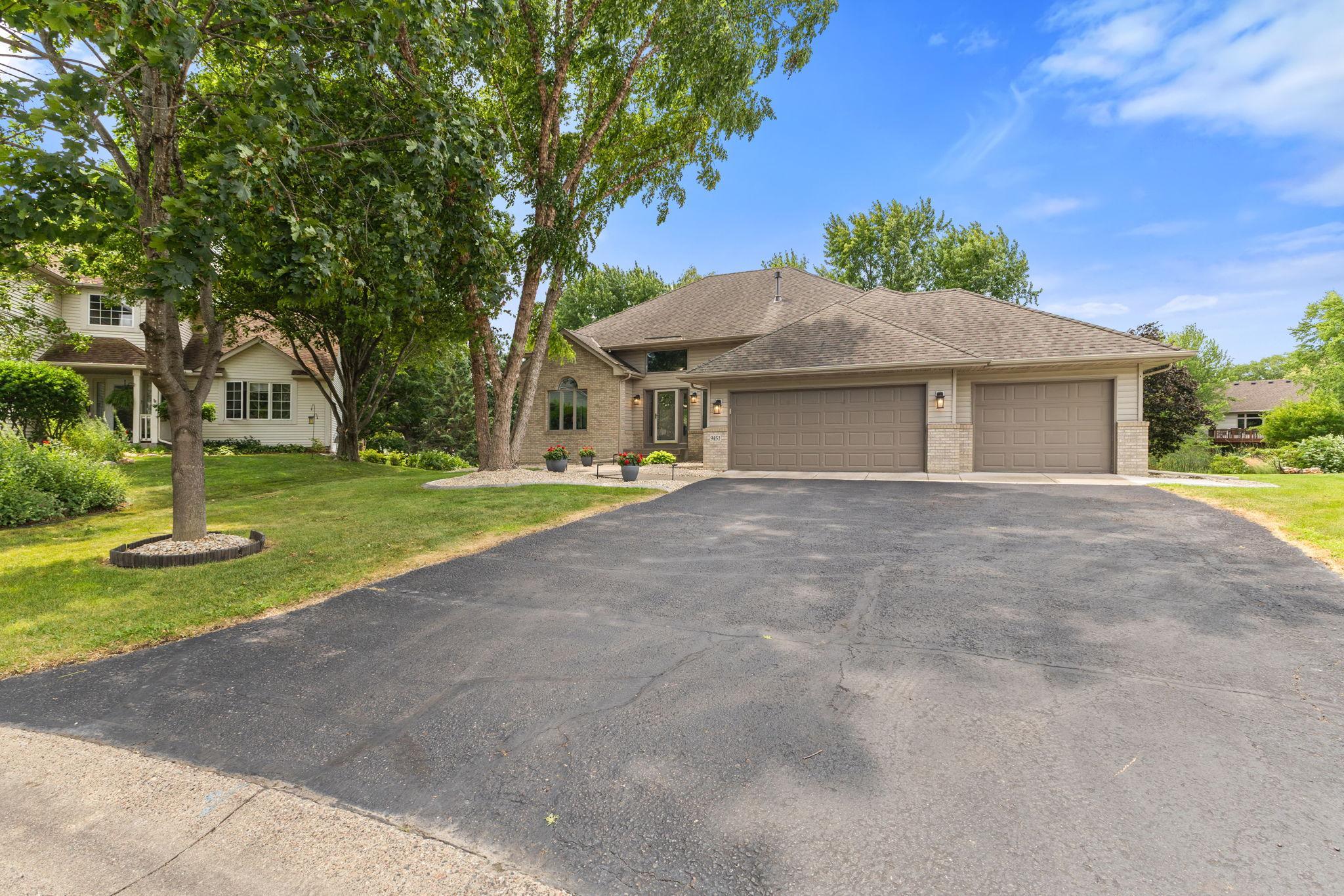 An oversized driveway provides plenty of space for guests and family gatherings.